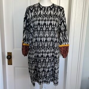 Anthropologie Patterned Navy Blue and White Dress with Orange cuffs.